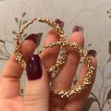 GOLD STATEMENT CHARM HOOP EARRINGS™