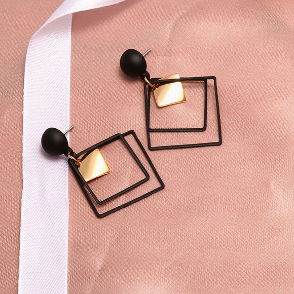 TWO TONE GEOMETRIC DANGLE EARRINGS™