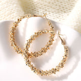 GOLD STATEMENT CHARM HOOP EARRINGS™