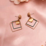 TWO TONE GEOMETRIC DANGLE EARRINGS™